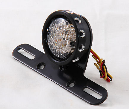 LED tail light with drilled black lens bezel.
