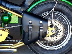 "STASH BAG" left side swingarm saddlebag available in black and distressed brown leather.