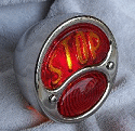 Model A tail Light with "STOP" script in glass lens.