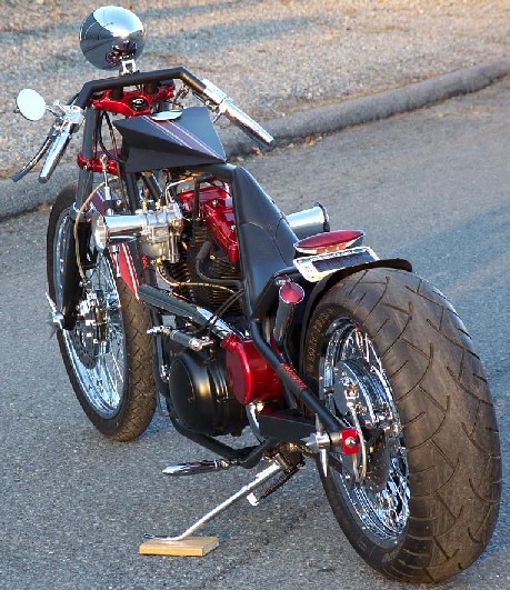 Evo Sportster powered pro-street custom by Mizur of DeVille Cycles. Dual S&S Super "E" carbs feeding ported Buell X-1 heads, with A LOT of compression and cam... even with the chassis streched 15 inches, it STILL wants to stand up on the tire.