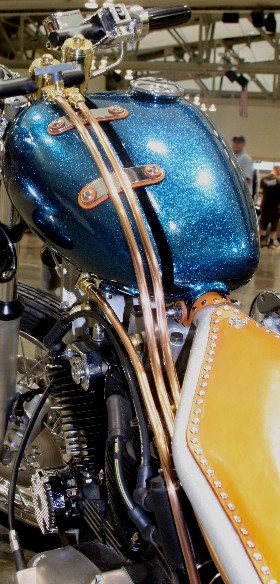 DeVille Split Tanks hold 3+ quarts of oil in the left and 2 gallons of gas on the right.